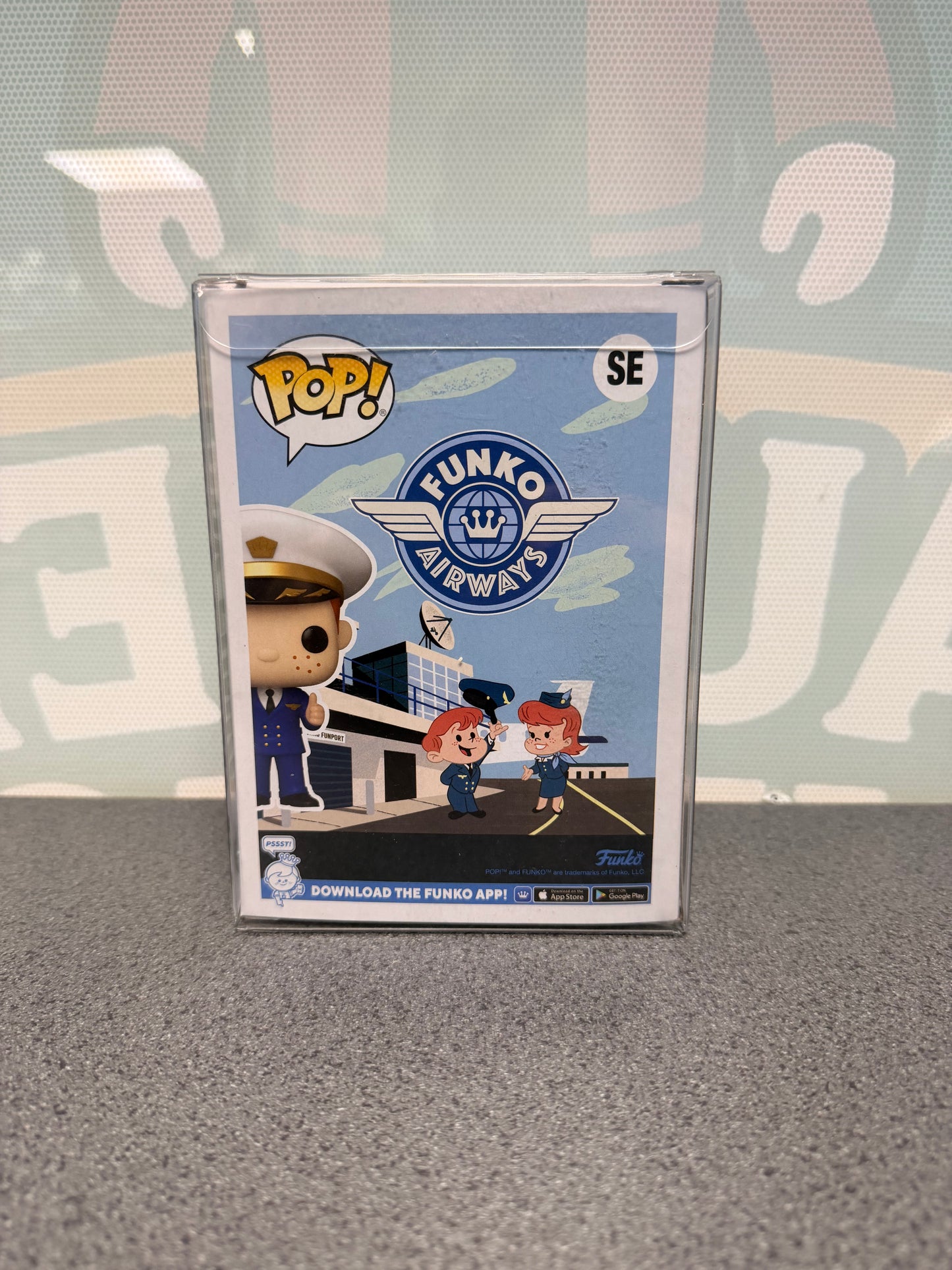 Rear of Freddy Funko Pilot Pop! SE with Funko Airways artwork and airport graphics.