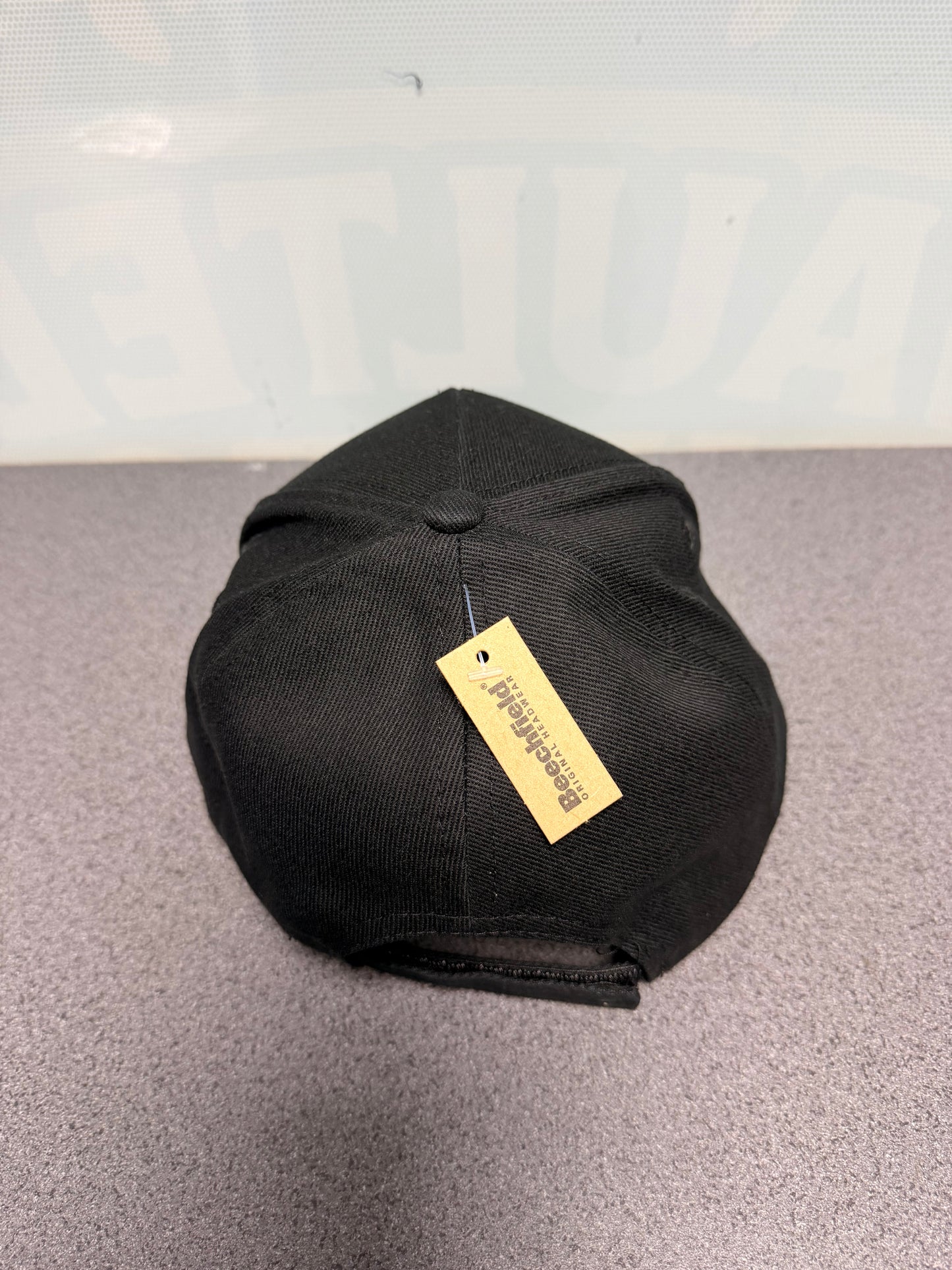 Black Vaulted Vibes baseball cap, rear view showing adjustable strap
