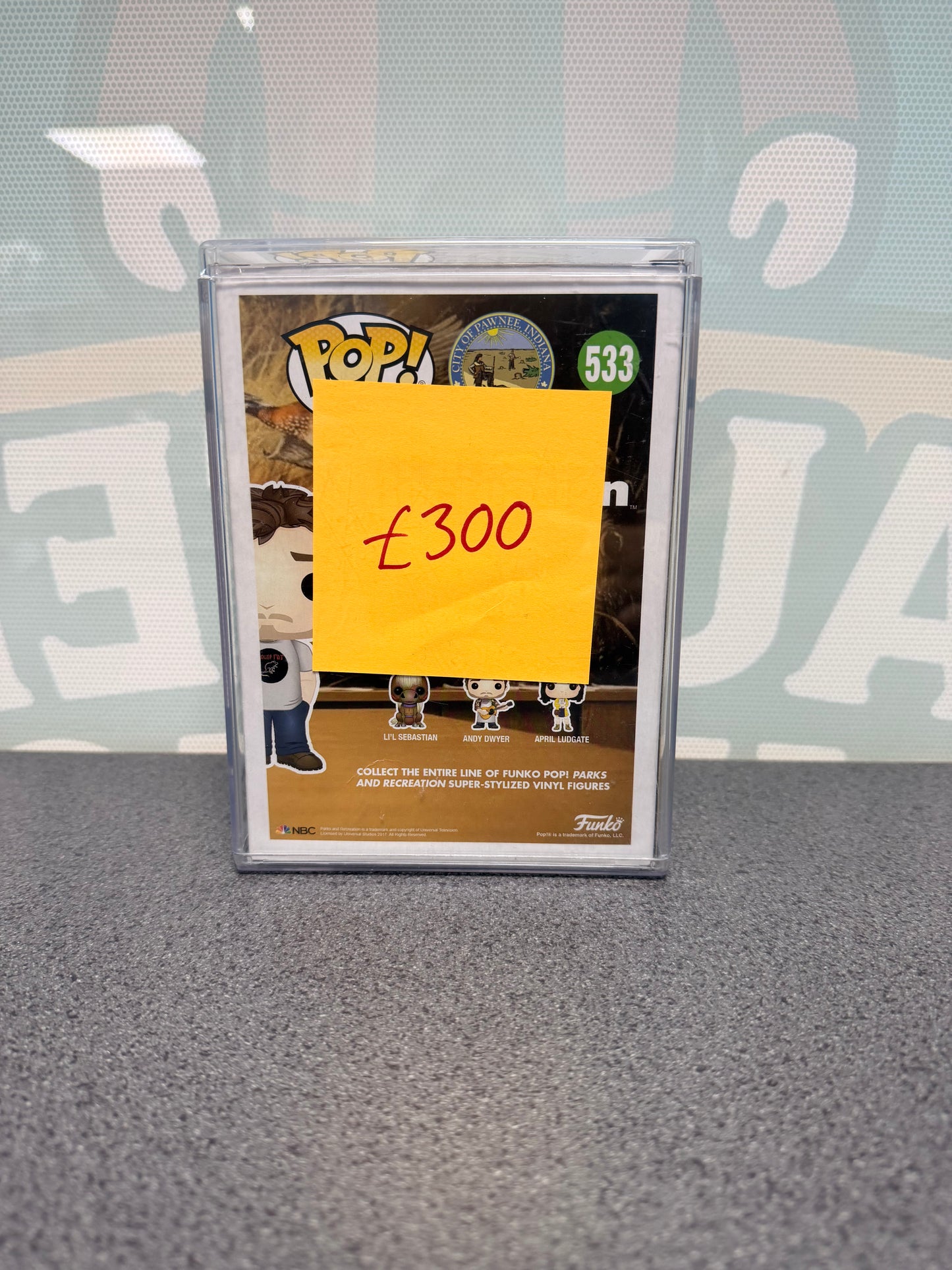Andy Dwyer Funko Pop #533, Parks and Recreation, Fugitive Toys 500-piece exclusive – rear of the box, partly covered by a price note