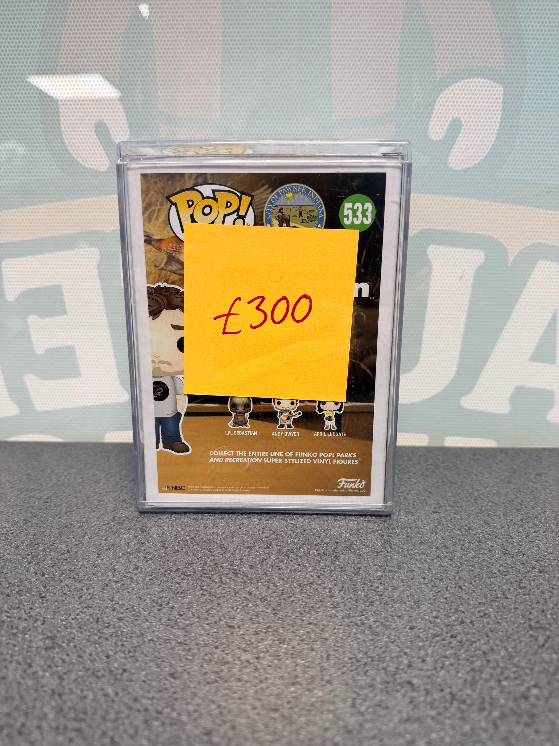 Andy Dwyer Funko Pop #533, Parks and Recreation, Fugitive Toys 500-piece exclusive – rear of the box, partly covered by a price note