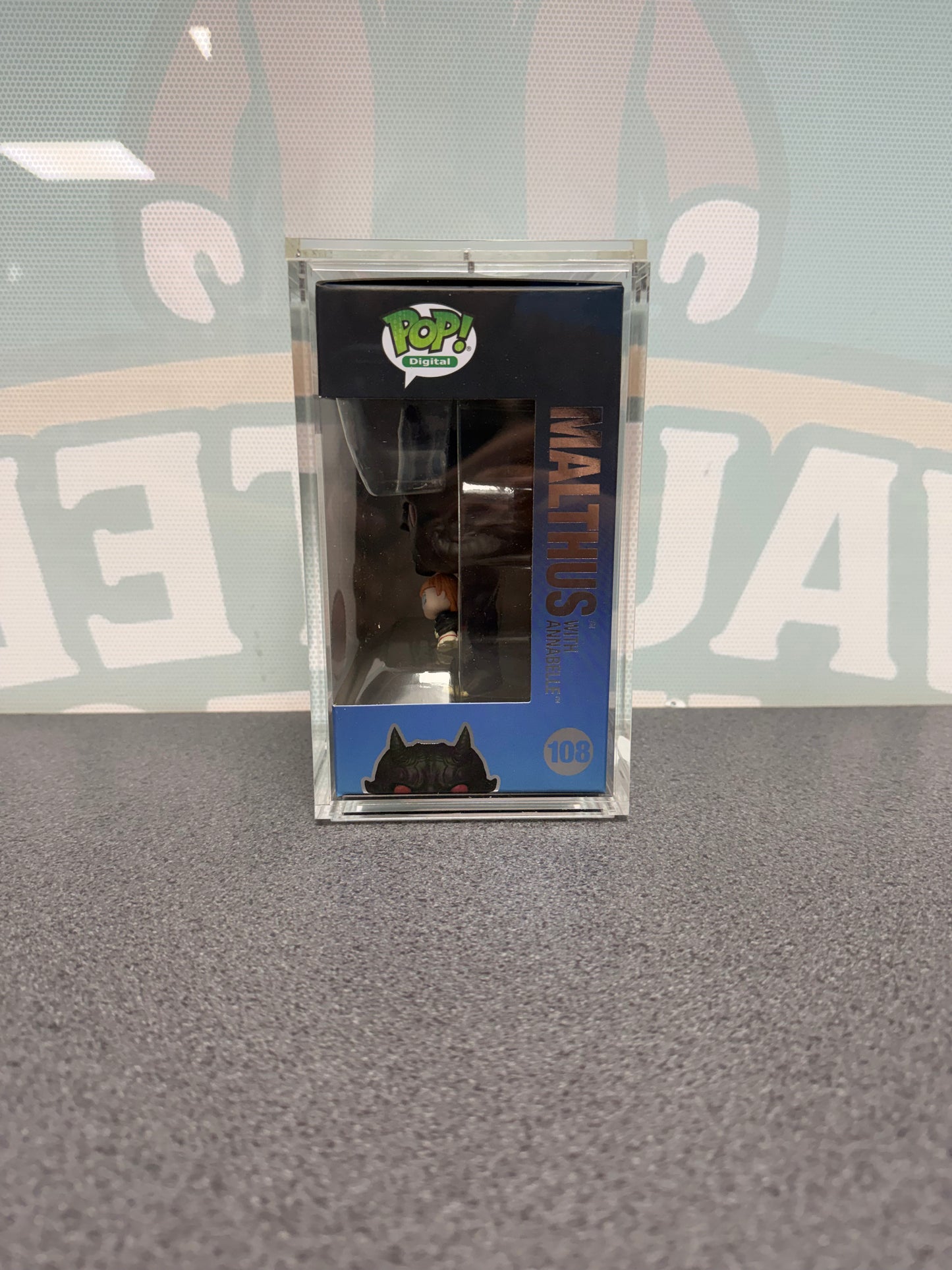 Malthus with Annabelle Funko Pop! Digital #108 – window side of box