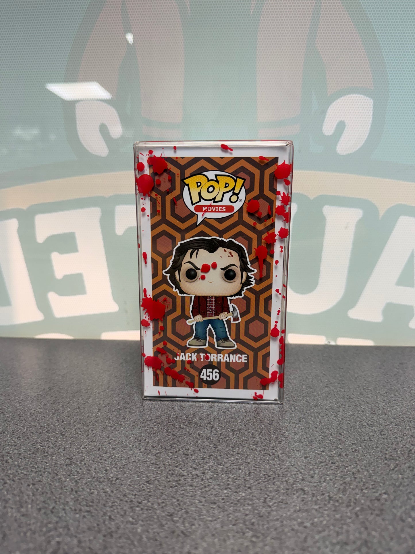 Jack Torrance Funko Pop! #456 Frozen Chase – The Shining – illustrated side of box in red-splatter protector