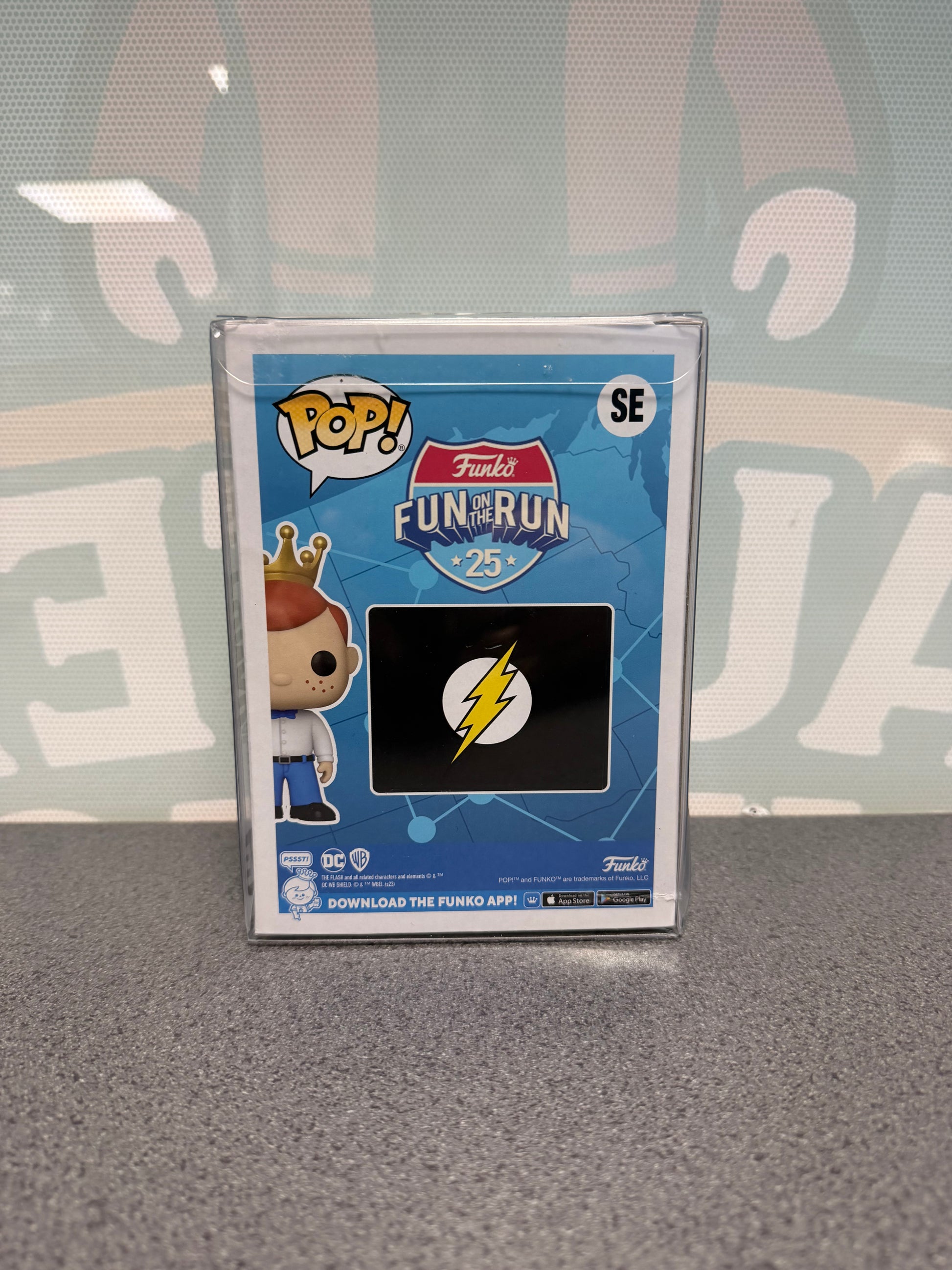 Rear of Freddy Funko as The Flash Chase Pop! SE with the lightning-bolt logo and Fun on the Run artwork.