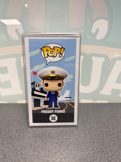 Illustrated side of Freddy Funko Pilot Pop! SE with the character in front of an airport.