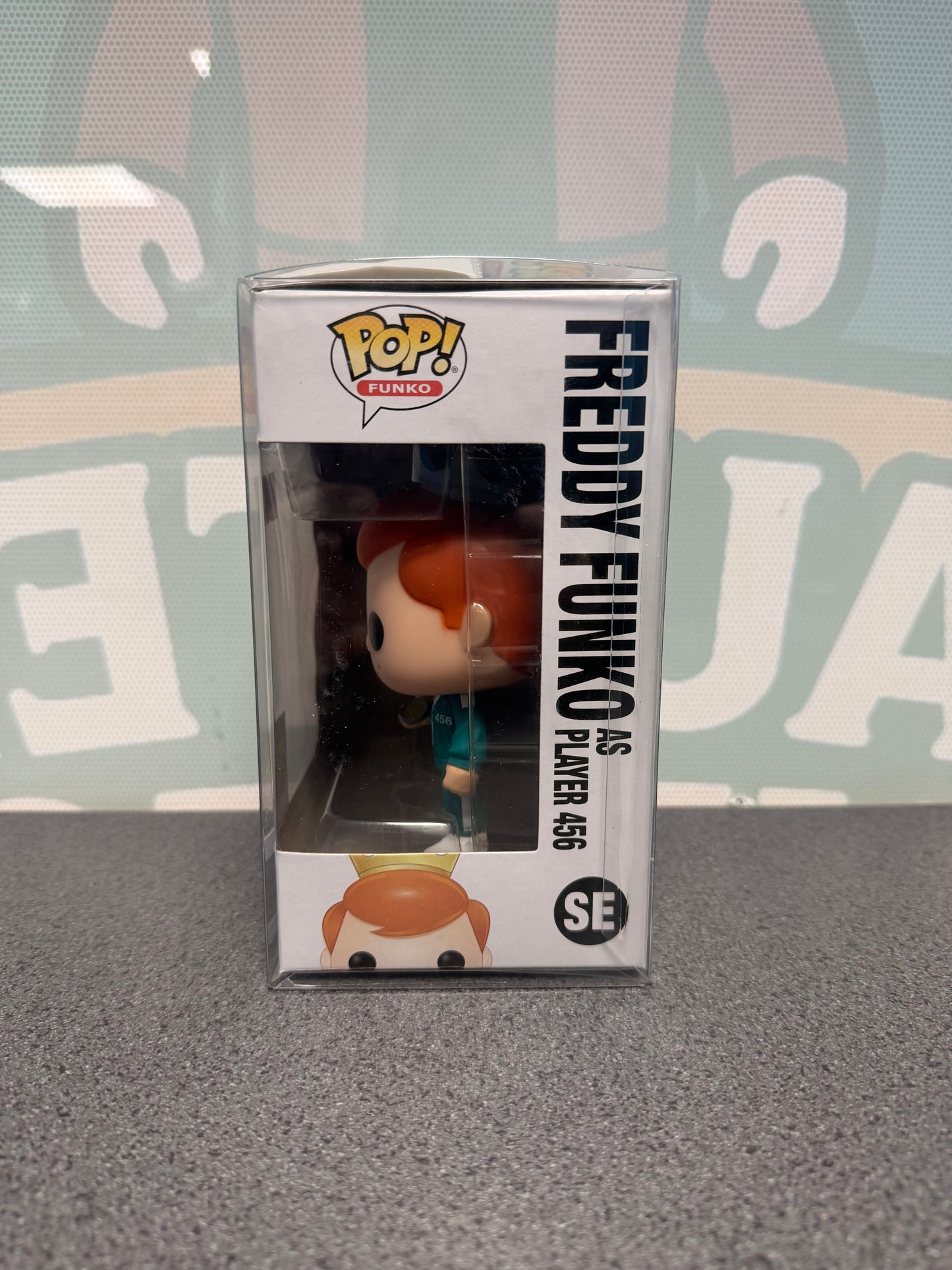 Window side of Freddy Funko as Player 456 Pop! SE showing the figure in profile.
