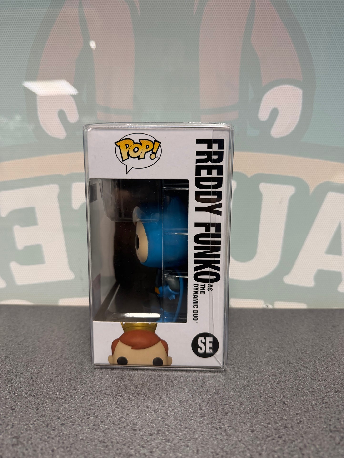 Window side of Freddy Funko as the Dynamic Duo Pop! SE showing the Batman figure in profile.