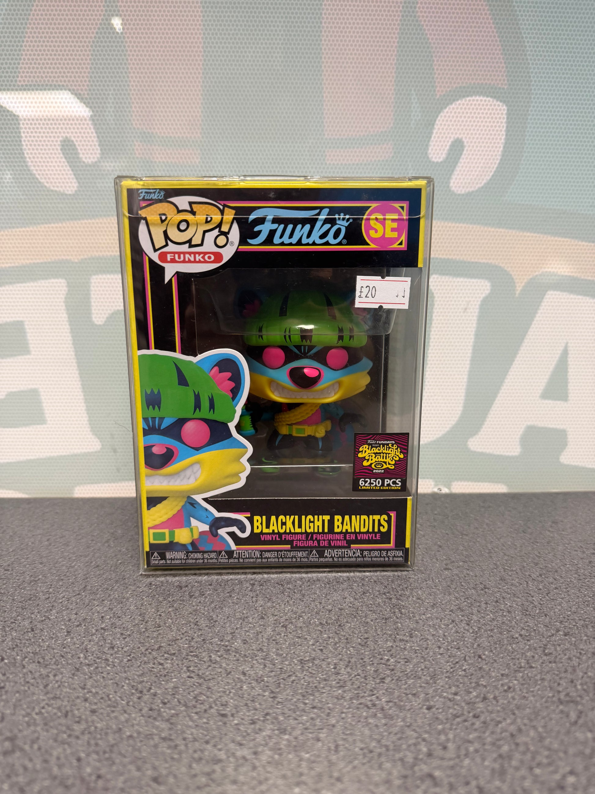 Front of Blacklight Bandits Funko Pop! SE with the 6,250-piece Blacklight Battle sticker.