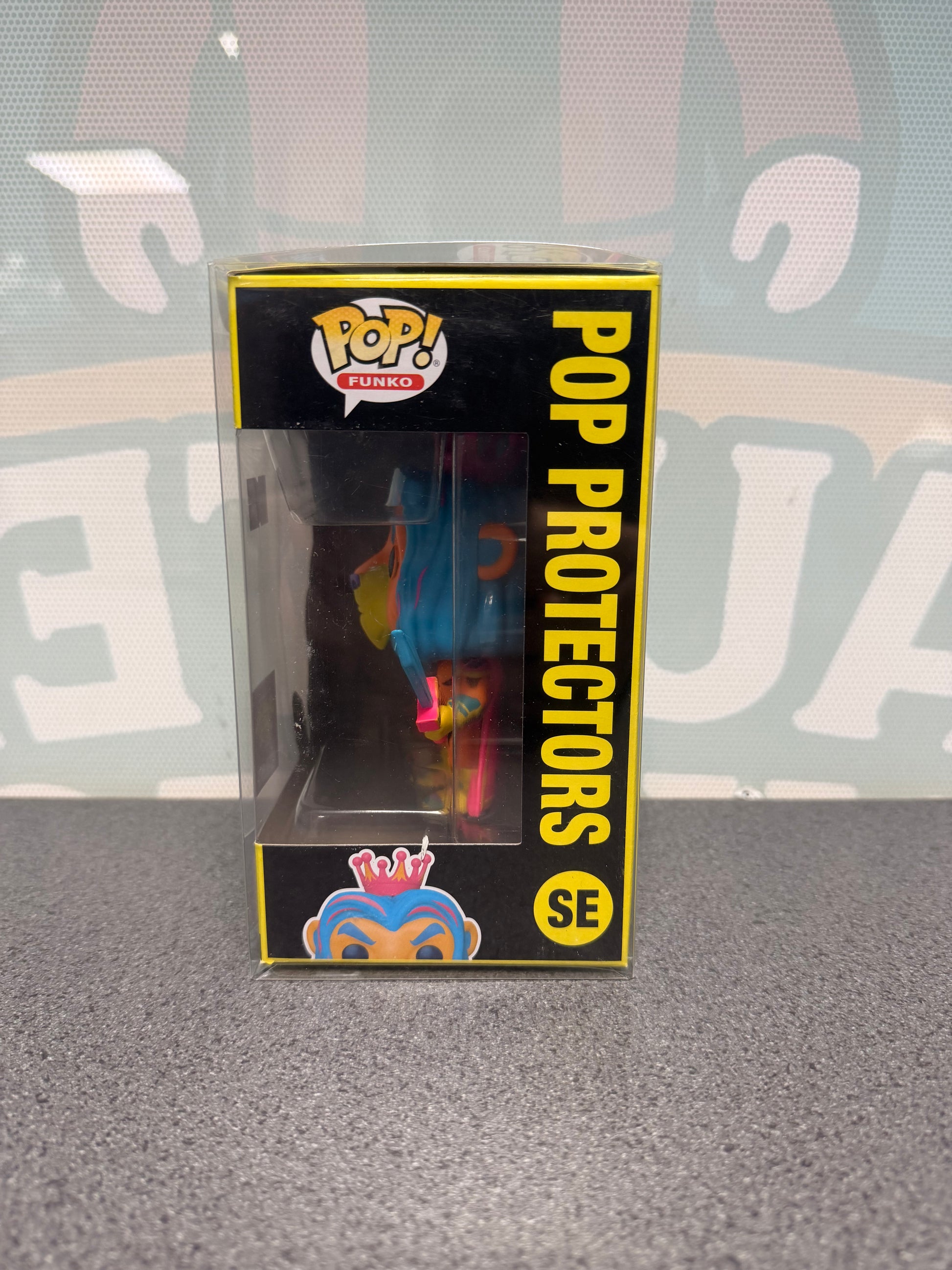Window side of the Pop Protectors Funko Pop! SE box showing the lion mascot in profile.