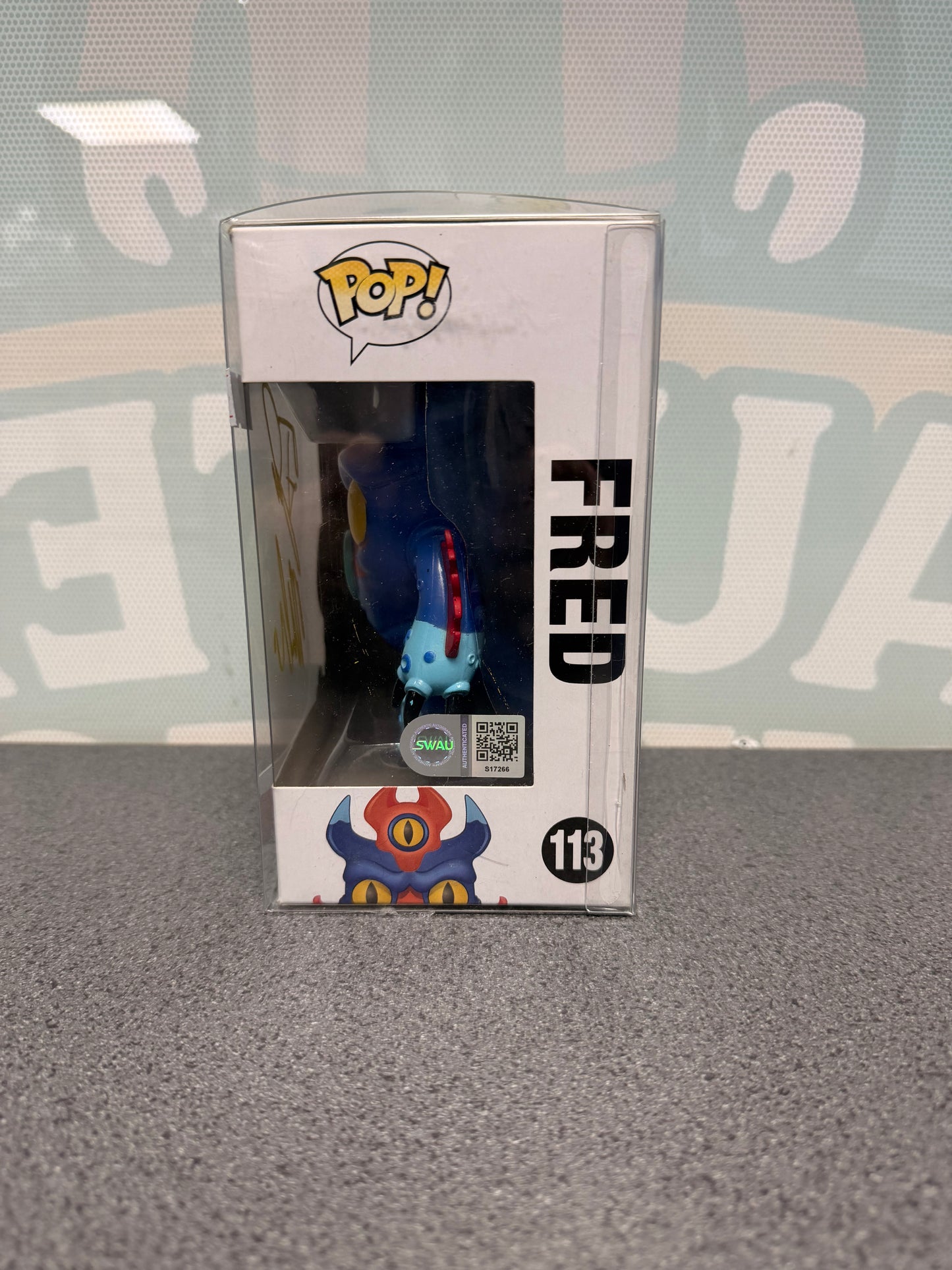 Fred Funko Pop! #113 window side showing SWAU authentication S17266