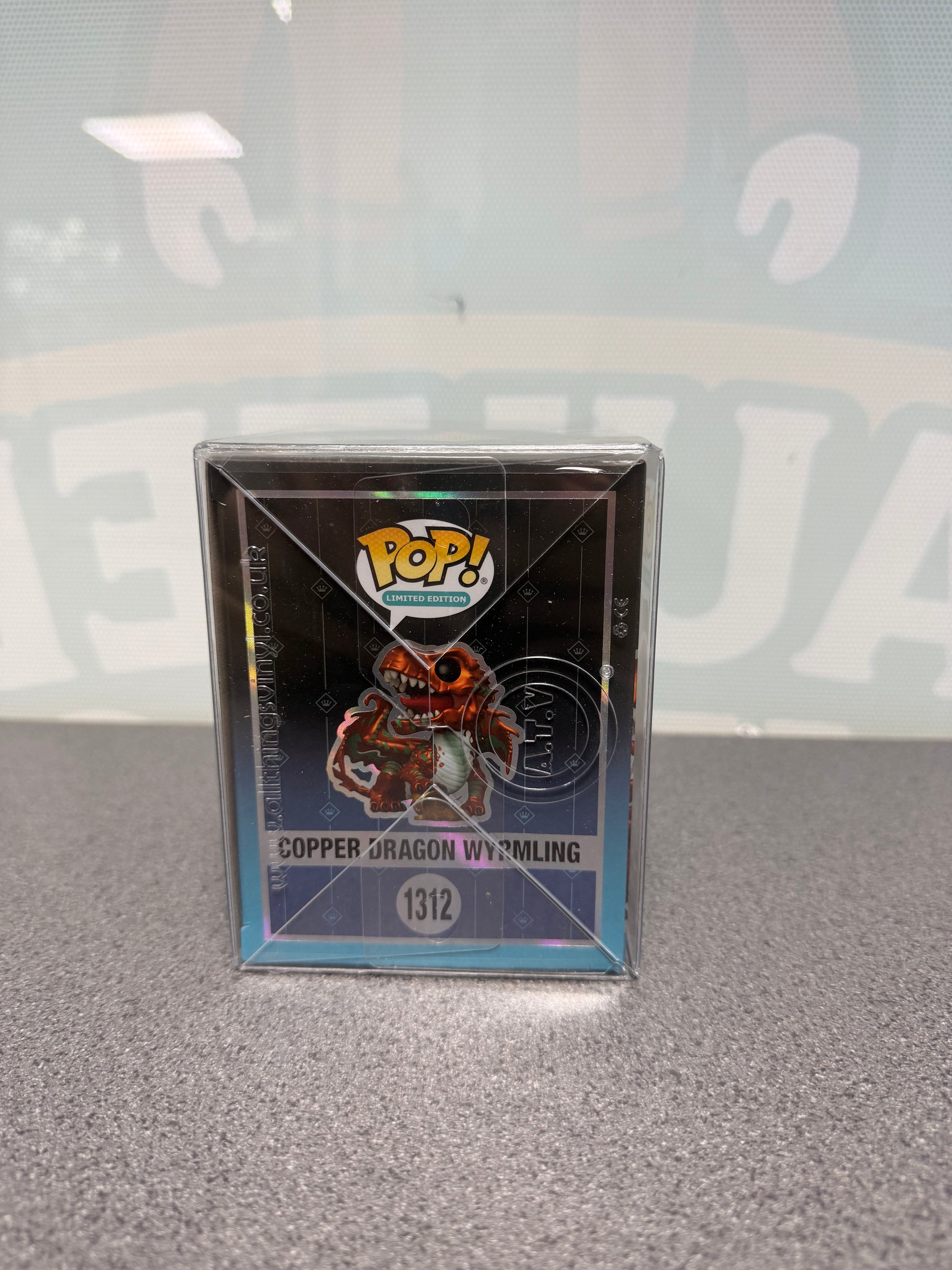 Illustrated side panel of Copper Dragon Wyrmling Metallic Funko Pop! #1312 packaging